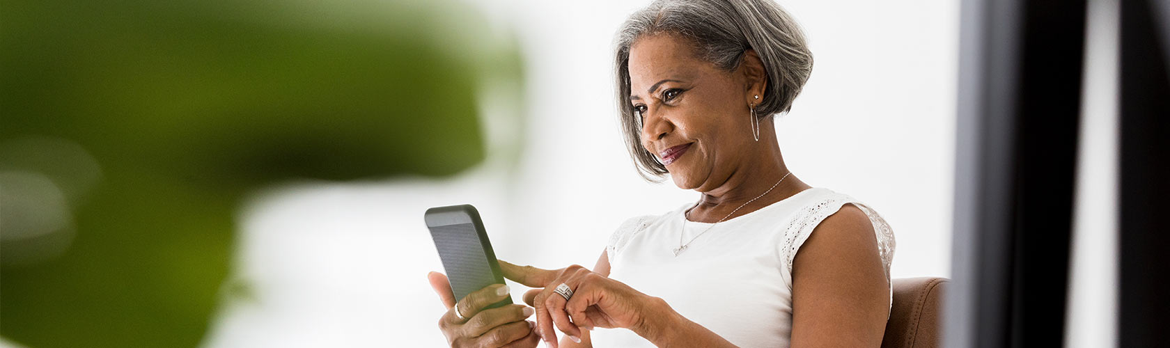 woman looking at smartphone