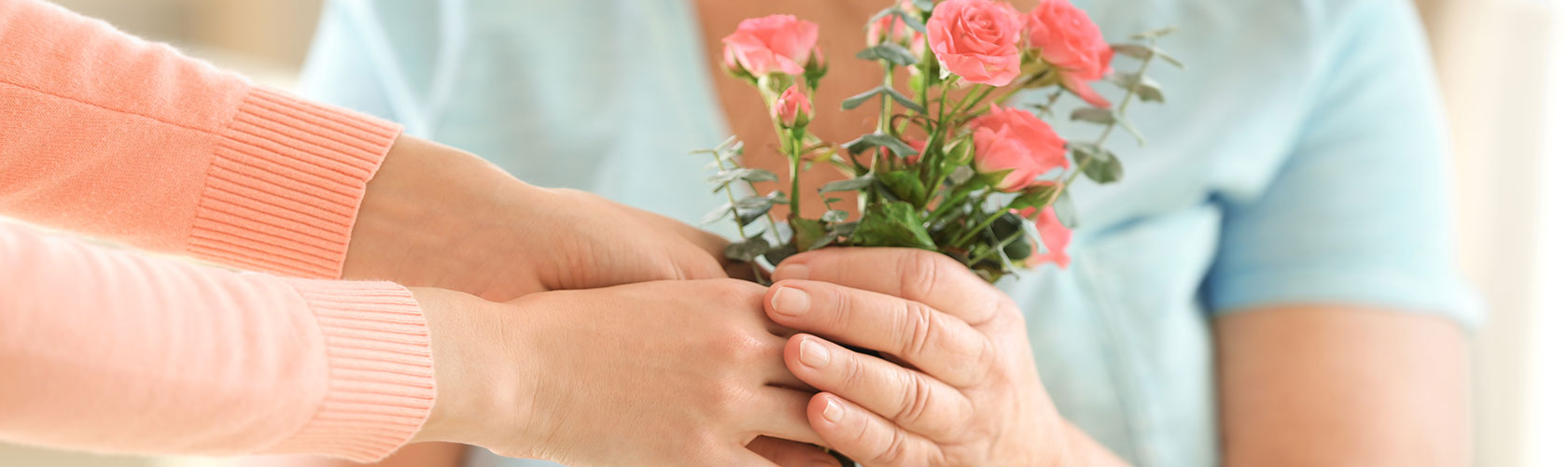 hands holding flowers